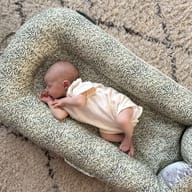 Dock-a-Tot Deluxe nest and La Maman Wedge Nursing Pillow