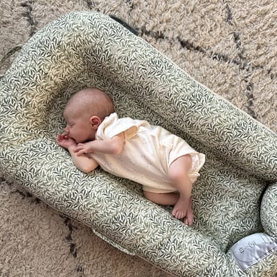 Dock-a-Tot Deluxe nest and La Maman Wedge Nursing Pillow